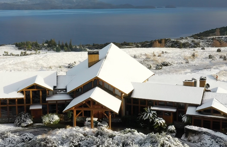 Aerial shot of Fiordland Lodge, Lake Te Anau and Southern Alps in Winter