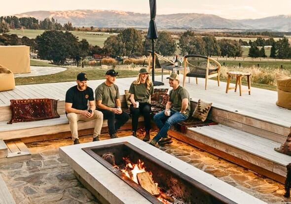 Guests sitting on outside deck at Lake Hawea Station